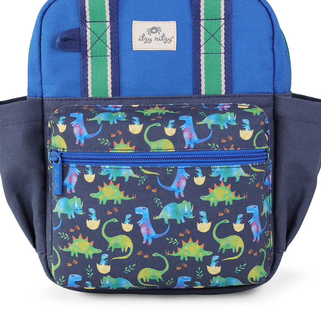 101601542 Itzy Bitzy Bag™ Toddler Backpack - Raining Dinos (22) Check out the Itzy Ritzy Sweetie Strap Plus Bear Silicone Pacifier Clip, featuring a charming bear design with blue and navy colors, green and blue striped straps, and a front zippered pocket.