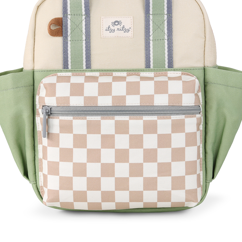 101601544 Itzy Bitzy Bag™ Toddler Backpack - Check Yes! (2) Front view of the Itzy Ritzy Sweetie Strap Plus Bear Silicone Pacifier Clip featuring a beige and white checkered front pocket, green and beige fabric, and striped straps. A small logo tag is visible above the pocket.