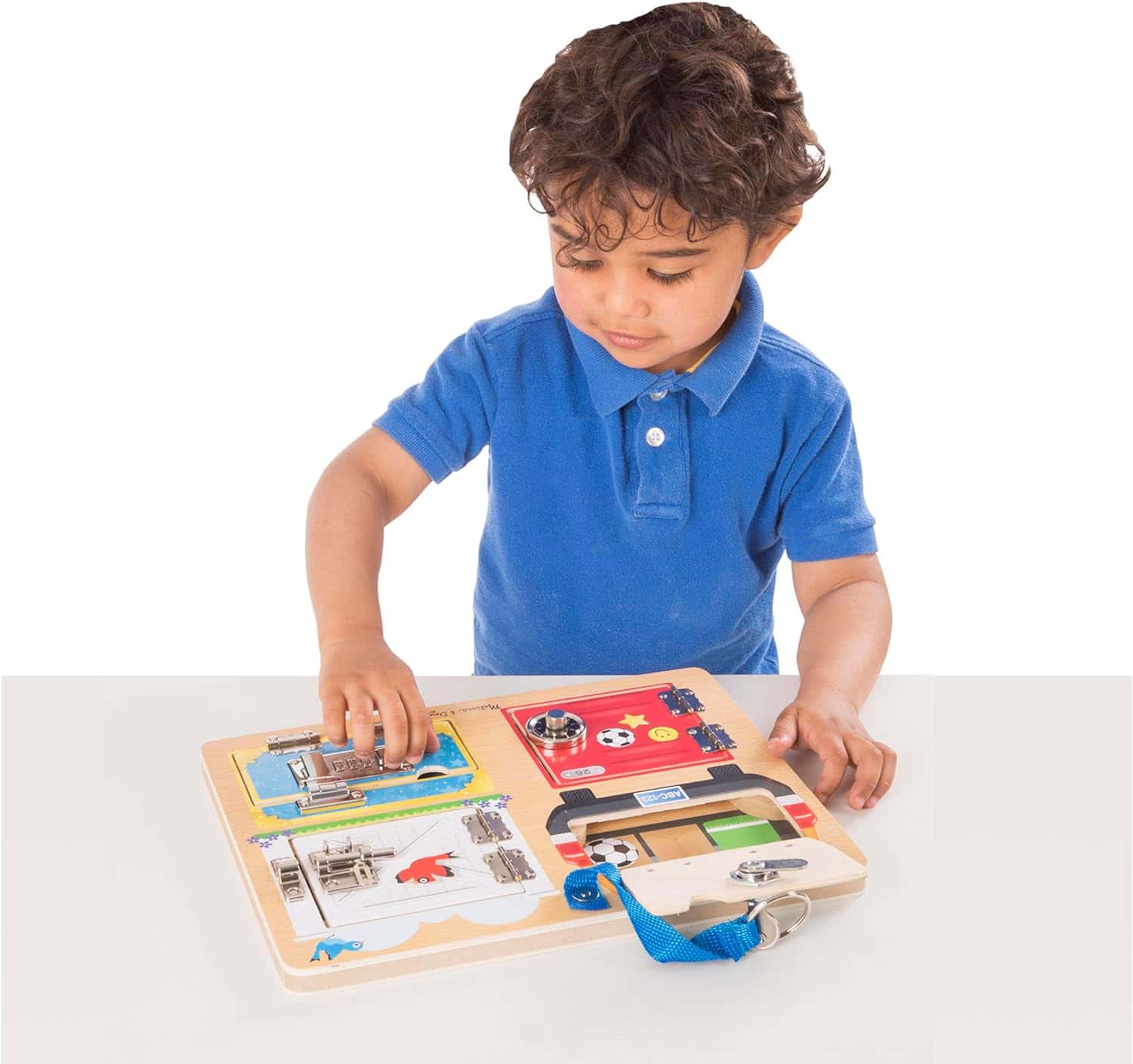 Melissa-and-Doug-Locks-and-Latches Board-Wooden Educational-Toy-9540 (8) A young boy playing with the Melissa & Doug Locks and Latches Board.