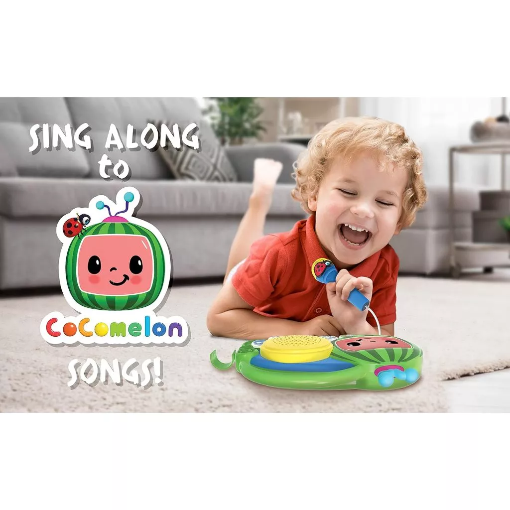 Cocomelon Toy My First Sing Along Boombox Working Microphone Music Singalong Toddler (3) A joyful child in a red shirt plays with the CoComelon Toy My First Sing Along Boombox, featuring a working microphone and drum. The text "Sing along to CoComelon songs!" appears beside the CoComelon character logo.