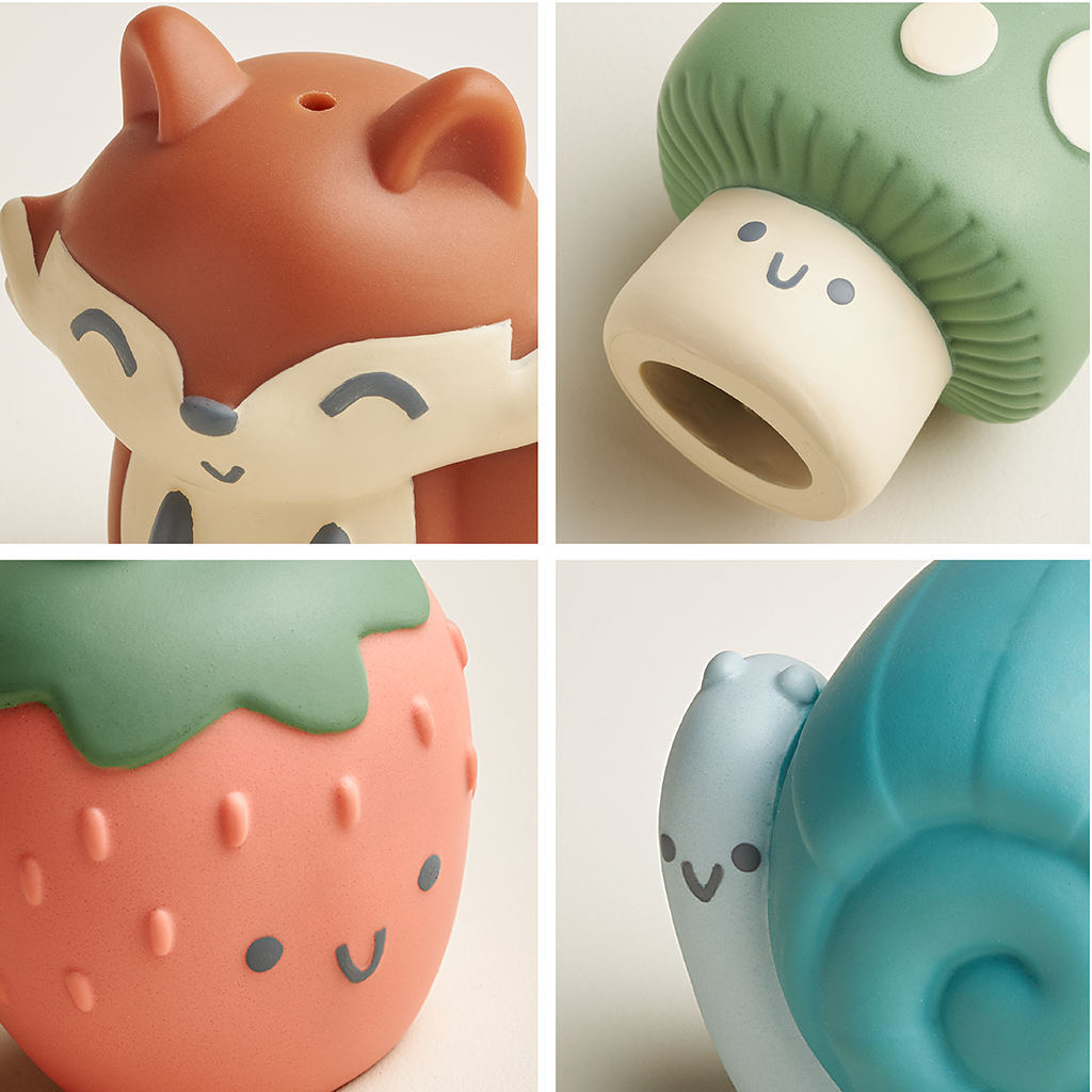 FP8560_Itzy_Ritzy_Bath_Itzy_Bitzy_Finger_Puppets The Itzy Ritzy Finger Puppets Bath Toys, featuring a brown fox, a green mushroom with a light beige base, a pink strawberry with green leaves, and a blue snail—all sporting cheerful smiles—are arranged in an adorable two-by-two grid.