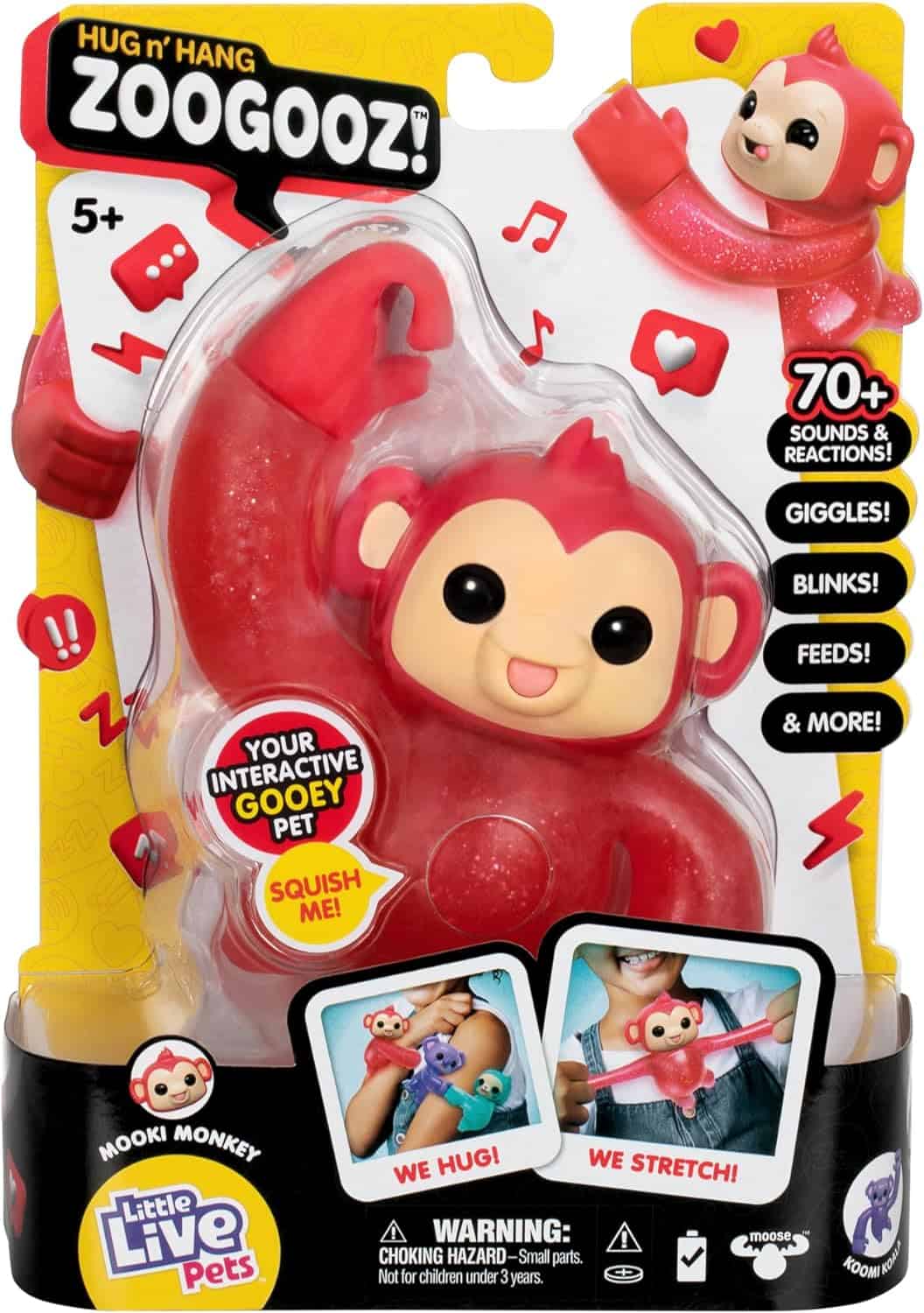 Little Live Pets Hug n' Hang Zoogooz - Mookie Monkey. an Interactive Electronic Squishy Stretchy Toy Pet with 70+ Sounds & Reactions. Stretch, Squish & Link Their Hands Medium (1) A toy package containing a 'Zoogooz' interactive monkey named Mooki. The toy claims to giggle, blink, feed, and more with over 70+ sounds and reactions. Suitable for ages 5 and up.