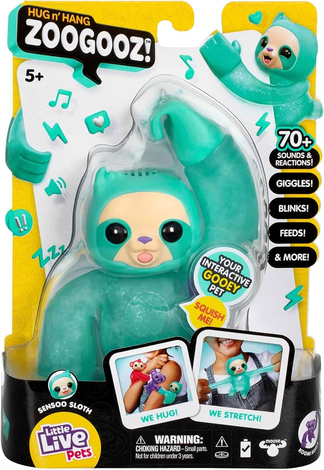 Little Live Pets Hug n' Hang Zoogooz - Sensoo Sloth. an Interactive Electronic Squishy Stretchy Toy Pet with 70+ Sounds & Reactions. Stretch, Squish and Link Their Hands (1) A teal-colored interactive toy sloth named "Gropey" with limbs that can hug and stretch, in its packaging. The product promises over 70 sounds and reactions and is intended for ages 5 and up.