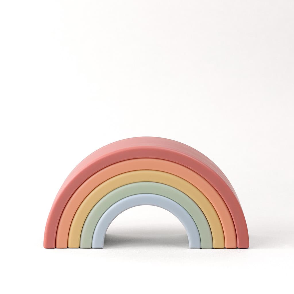 RS8548 Itzy Ritzy Rainbow Stacking Toy (2) A pastel-colored wooden rainbow toy with six arches, arranged in descending size order against a light background.