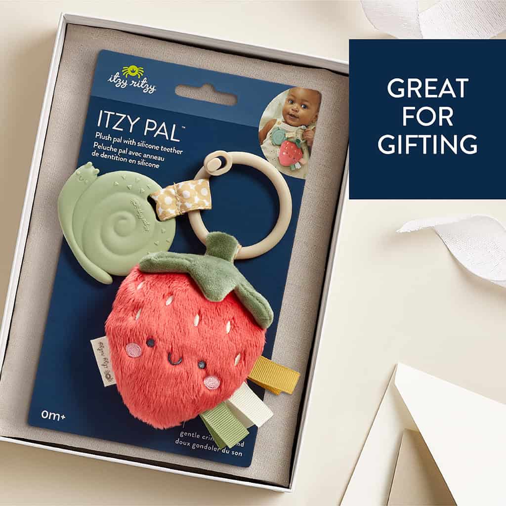 231220_Itzy_Ritzy_Digital_Shelf_ItzyPalStrawberry Baby's Itzy Ritzy - Itzy Pal - Plush Pal Infant Toy with Silicone Teether with ribbons in packaging, labeled as "great for gifting," displayed in a gift box.