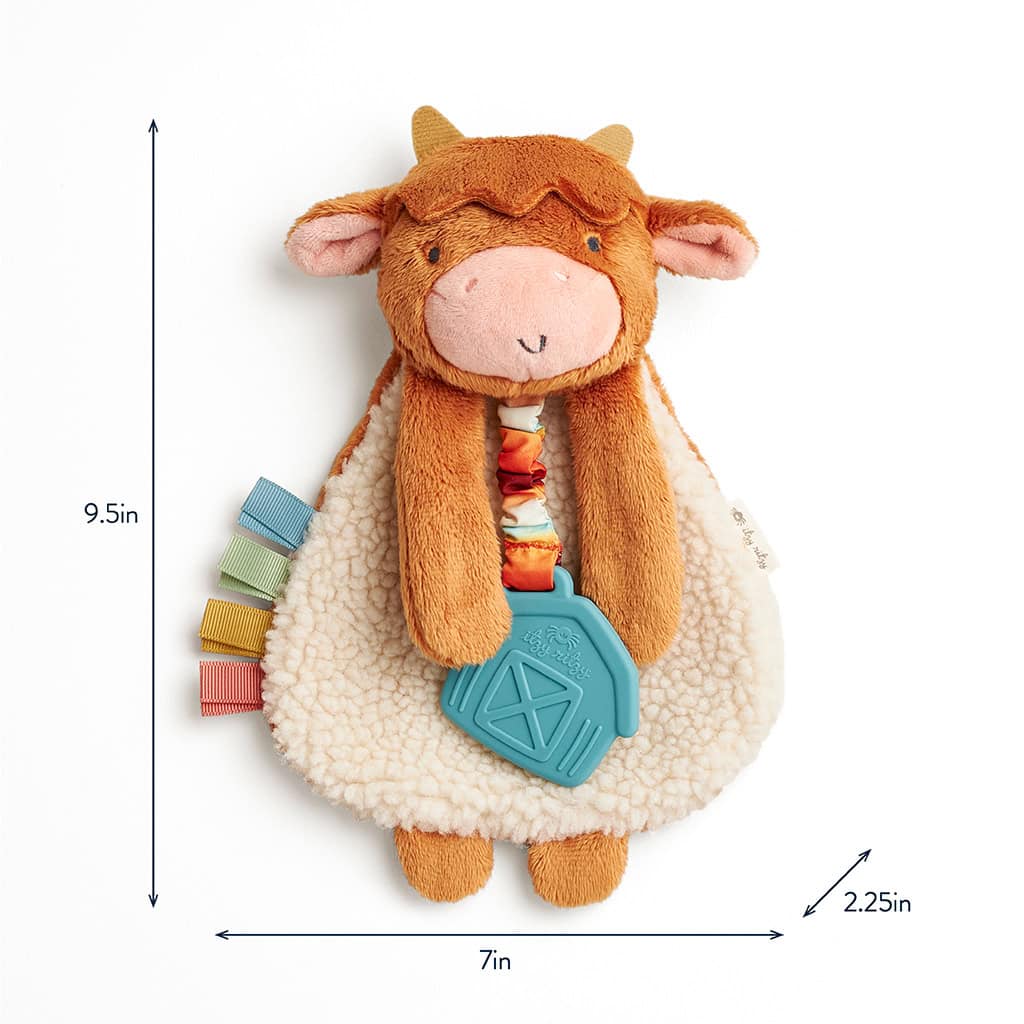 302801668_Itzy_Ritzy_Itzy_Lovey_Highland_Cow Plush toy cow with a soft cream and brown body, blue plastic teething ring, and colorful fabric tabs. Dimensions: 9.5 inches tall, 7 inches wide, and 2.25 inches thick.