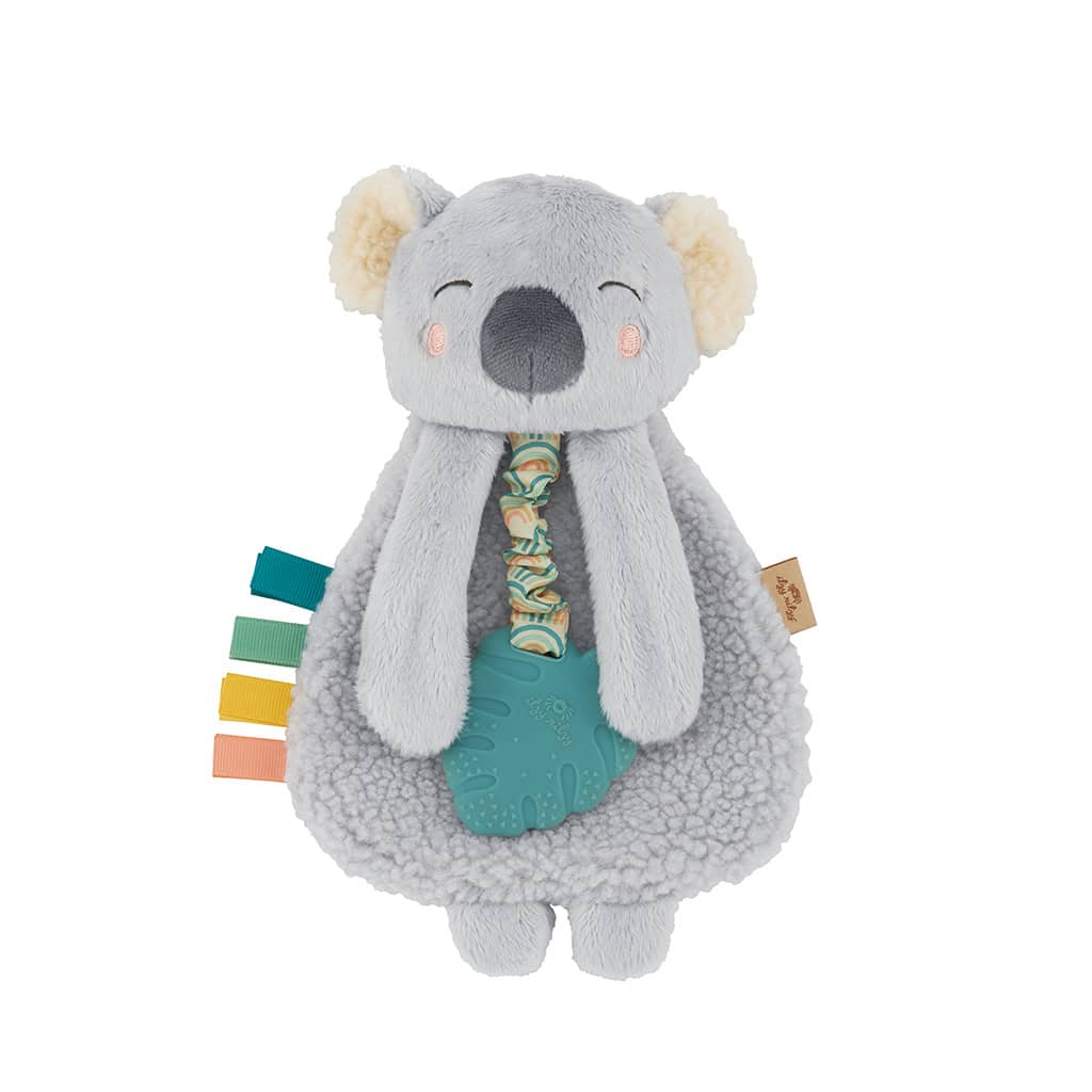 itzy-ritzy-lov8433-itzy-lovey-koala-6 A soft, grey koala plush toy with a round body, multicolored ribbons on one side, and a textured blue teether attached to its front.