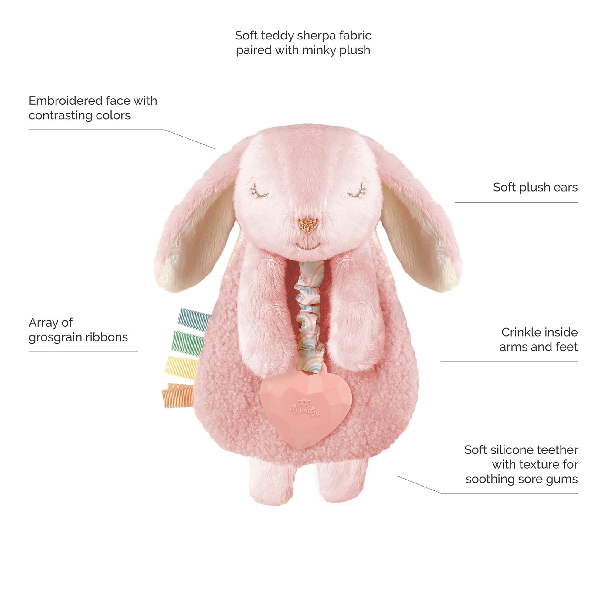 210413_Itzy_Friends_Call_Out_Images Plush pink bunny toy with embroidered face, soft plush ears, crinkle arms and feet, an array of grosgrain ribbons, and a soft silicone teether attached to a rattle heart.