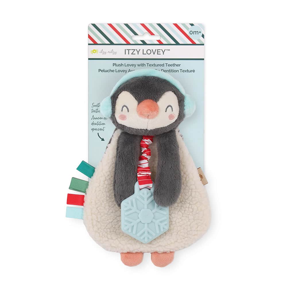itzy-ritzy-lov8503-itzy-lovey-holiday-north-the-penguin-1 A plush penguin toy with a textured teether, colorful tags, and a red and white striped scarf. The toy is packaged with a label on top marked "Itzy Lovey.