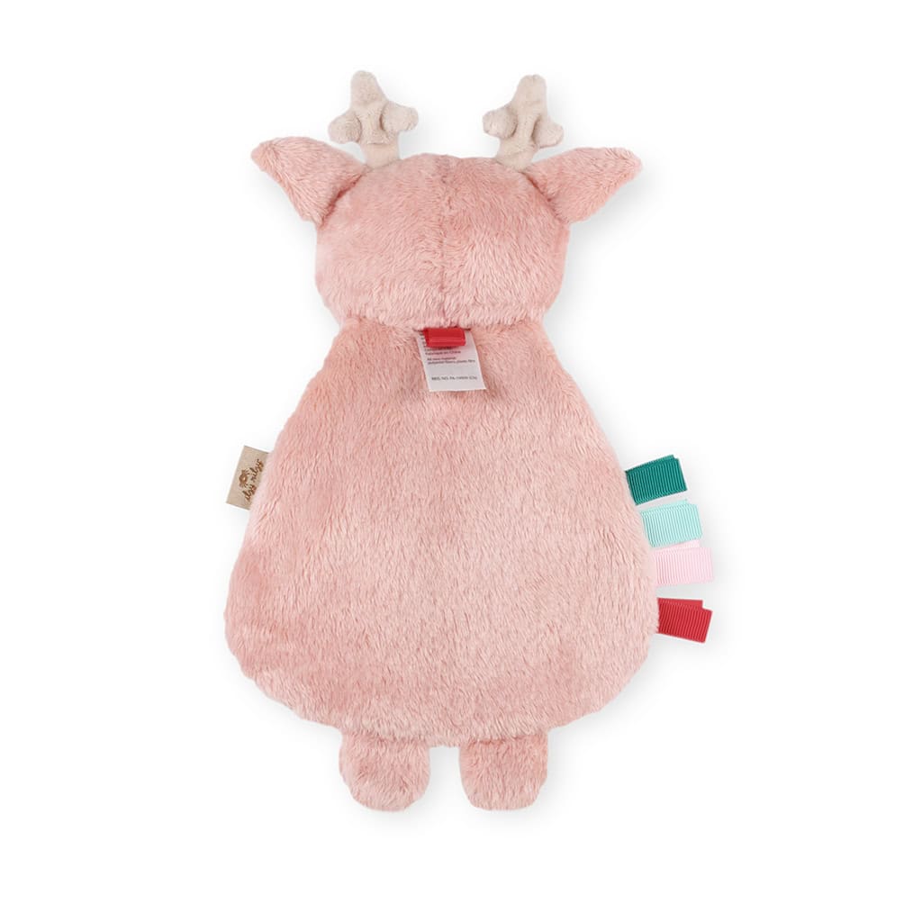 itzy-ritzy-lov8505-itzy-lovey-holiday-holly-the-reindeer-pink-3 A plush toy resembling a deer, viewed from the back, with pink fur, small beige antlers, and colorful tags attached.