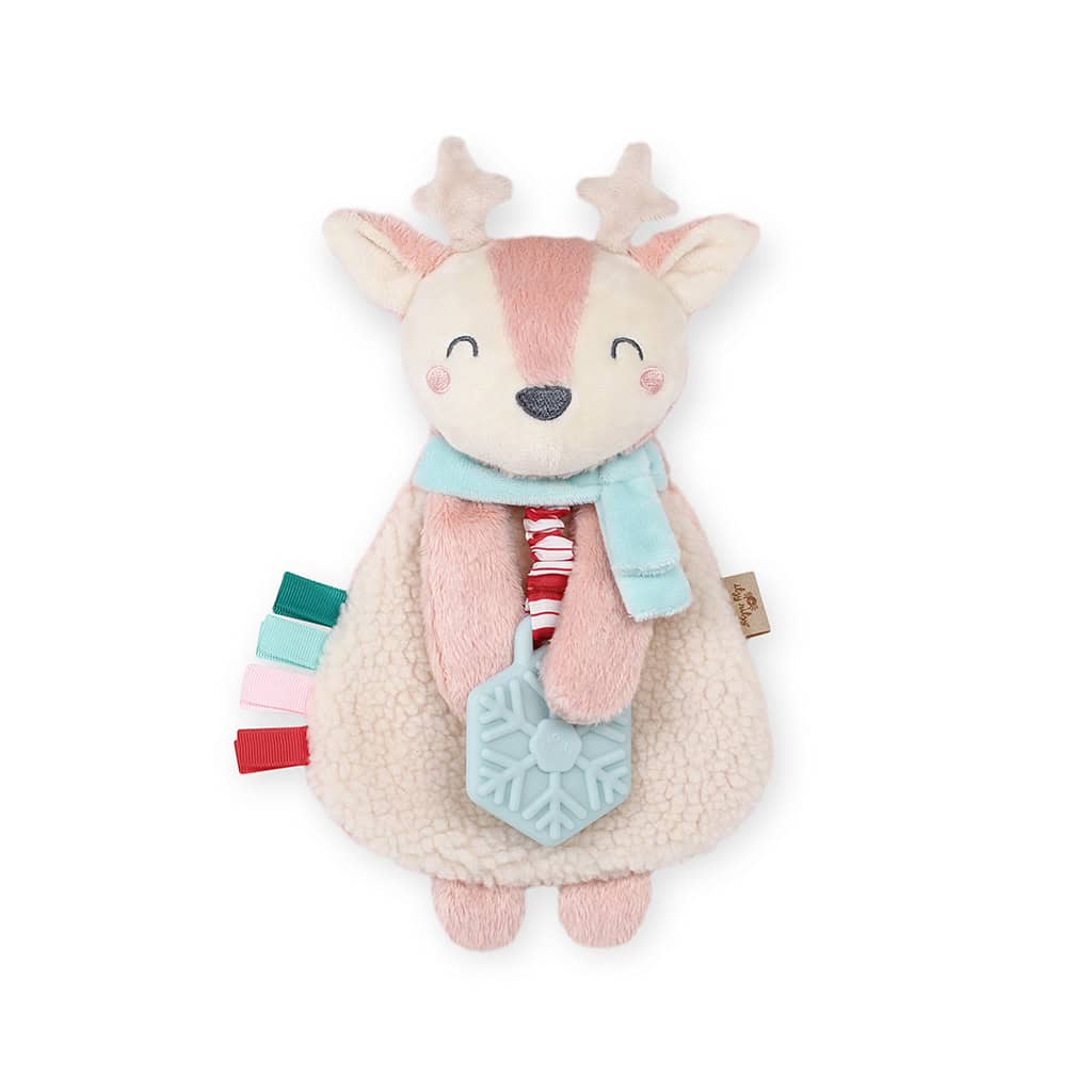 itzy-ritzy-lov8505-itzy-lovey-holiday-holly-the-reindeer-pink-4 A plush reindeer toy with white and pink fur, a light blue scarf, and a snowflake-shaped teething attachment.
