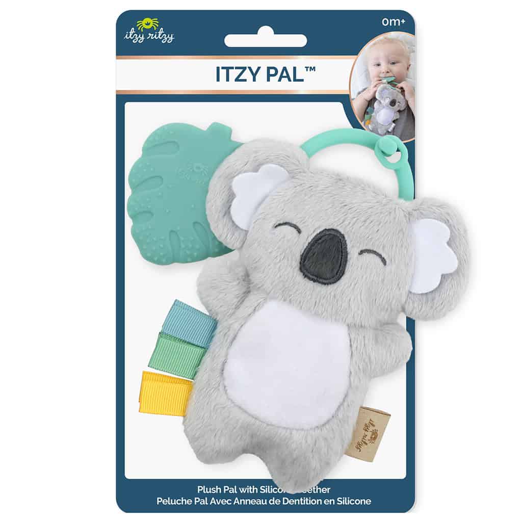 itzy-ritzy-tpl8443-itzy-pal-koala Packaged "Itzy Ritzy - Itzy Pal" baby teething toy featuring a plush gray koala with silicone teether and textured ribbons, displayed in a blue carded package with a baby's image.